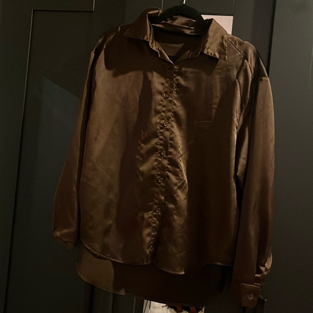 Chocolate brown woman’s button up, size small, never worn, no tags.